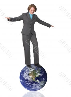 business woman balancing on earth