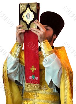 Orthodox priest rising ancient Holy Gospel