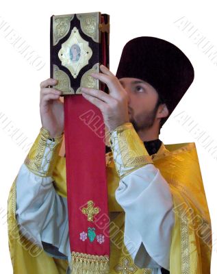 Orthodox priest rising ancient Holy Gospel