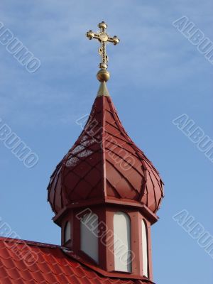 Orthodox Church with red Cupola with Holy Cross
