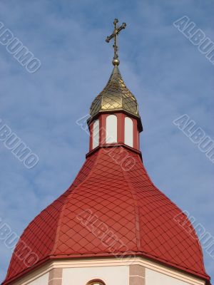 Orthodox Church with red Cupola with Holy Cross