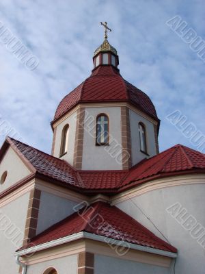 Orthodox Church with red Cupola with Holy Cross