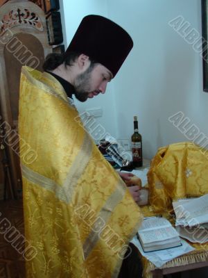 Orthodox priest prepares Sacred Participle foods