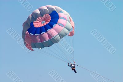 man flying on parachute