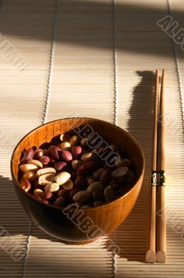Pannikin with peanut on the bamboo mat