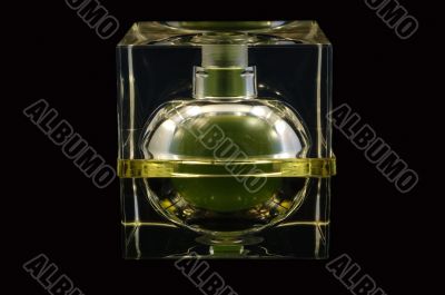 Bottle of perfume over black background
