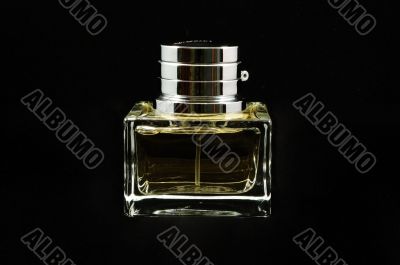 Bottle of perfume over black background