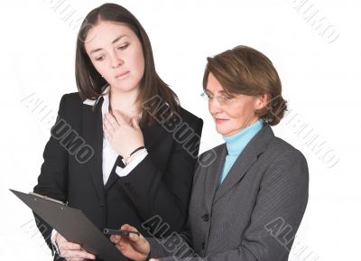 business women comparing notes