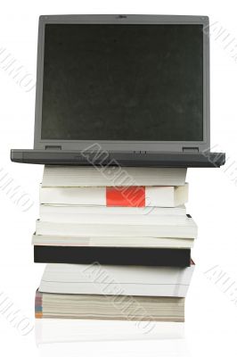 business laptop on top of books