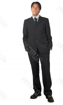 business man standing - hands in pockets