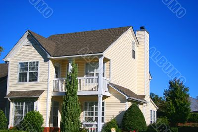 Yellow House Blue Sky