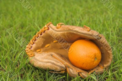An Orange in a Baseball Glove