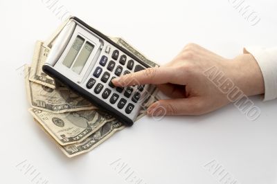 calculating over a fan of money