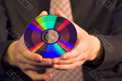 business hand holding CD