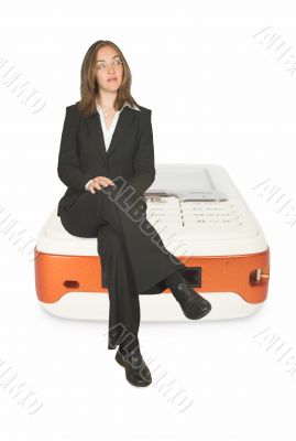 business communications - woman sitting on mobile
