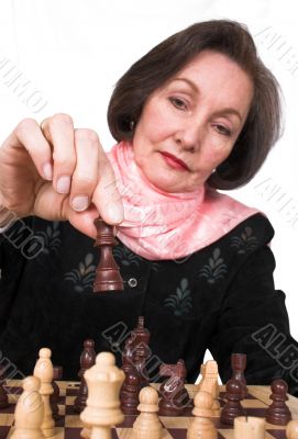 business woman playing chess