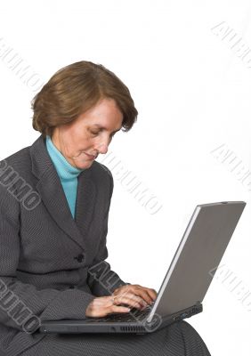 Business woman browsing on laptop