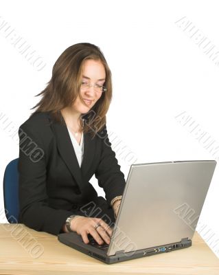 business woman happily using her laptop