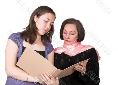 business women discussing notes