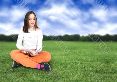 beautiful girl reading outdoors