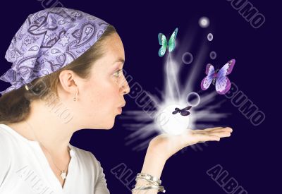 Beautiful girl blowing butterflies - mind reader