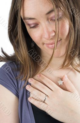 emotional woman with hand on hear chest