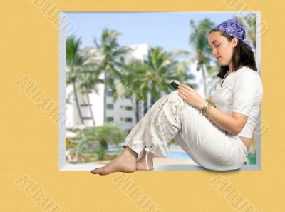 beautiful girl reading in a tropical resort