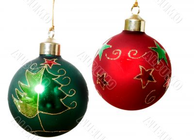 Two christmas balls over white