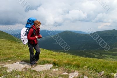 Hiker girl in mountains Hiker girl in mountains