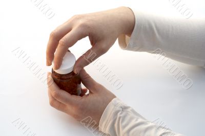 Opening a medicine bottle