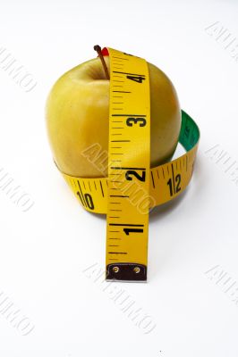 Yellow Apple with tape measure