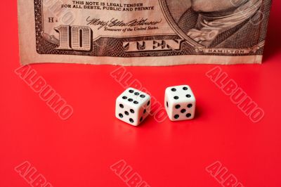 ten dollar and dices, on a red background
