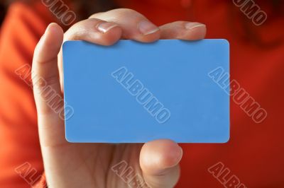 Woman with a credit card on her hand