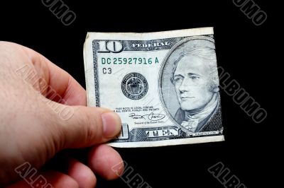 Man holding a ten dollar bill