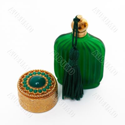 Antique gold box and green bottle