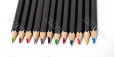Colored school pencils stacked. Macro