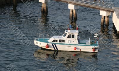 Green and white pilot boat
