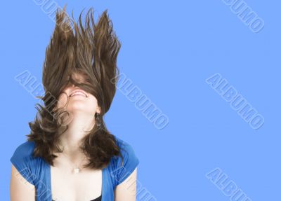 crazy womans hair over a blue background