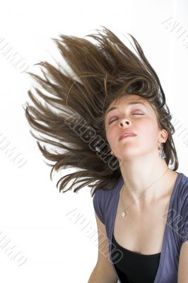 beautiful fashionable woman with moving hair