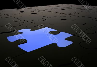 blue puzzle piece amongst black pieces