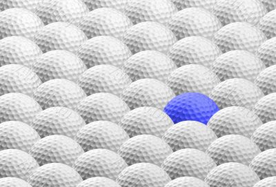 blue golf ball amongst many others
