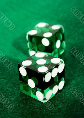 green dices over felt