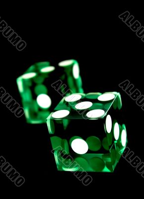 green dices on black