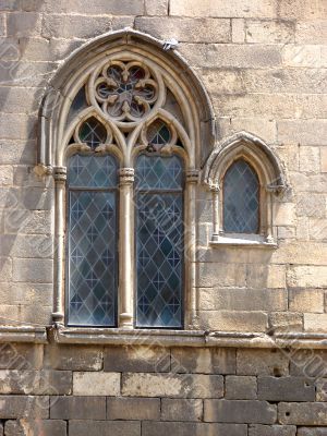 Ancient window of a cathedral . Barcelona