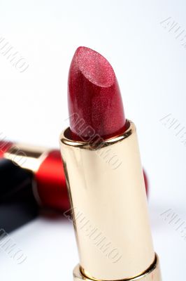 Tube of red lipstick. Macro shot