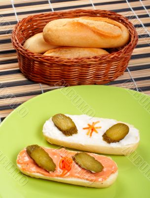 Two canapes on a green porcelain plate