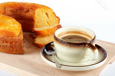 sponge cake with the cup of coffee and spoon