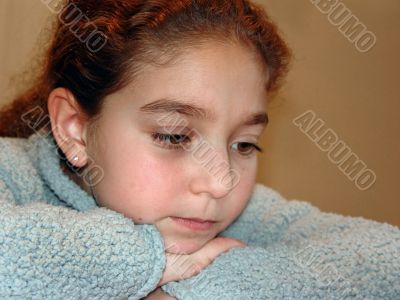 Cute girl thinking hard