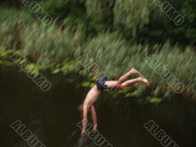 Boy jumping from the bridge Boy jumping from the bridge