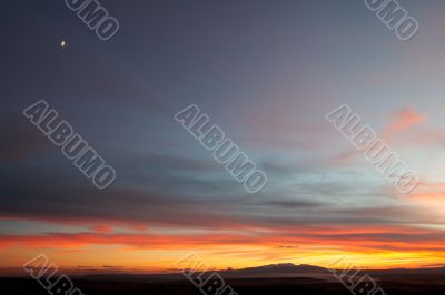 The moon over the sunset